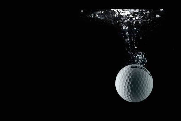 istock golf ball entering the water and splashing 1226445824