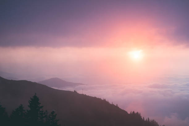 istock Dramatic cloudscape with the sun in warm colors. 1226446233