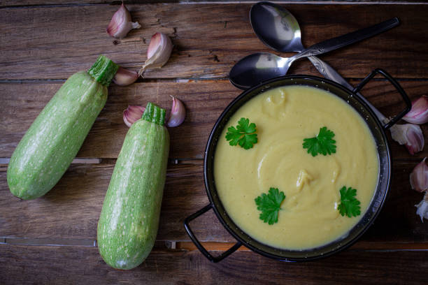 Homemade fresh marrow and onion cream on old pot