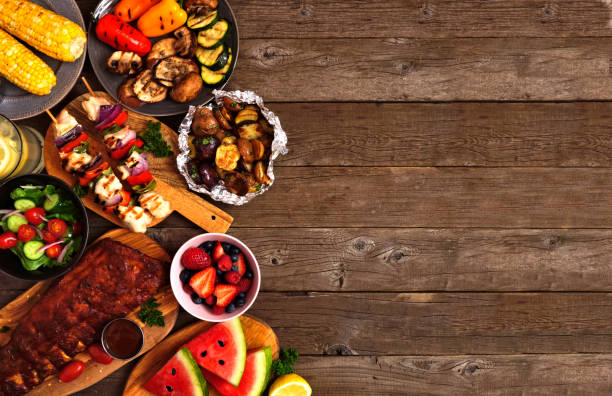istock Summer BBQ or picnic food side border over a rustic wood background, top view with copy space 1226450552
