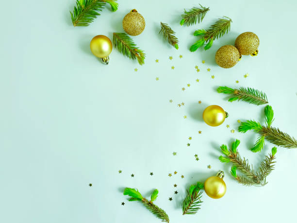 istock Christmas tree branch, toy on a colored background 1226453934