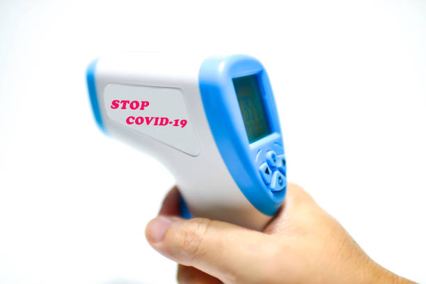 istock Hand holding Digital Infrared Thermometer (thermometer gun) for check forehead temperature measurement scan from Coronavirus 1226453970
