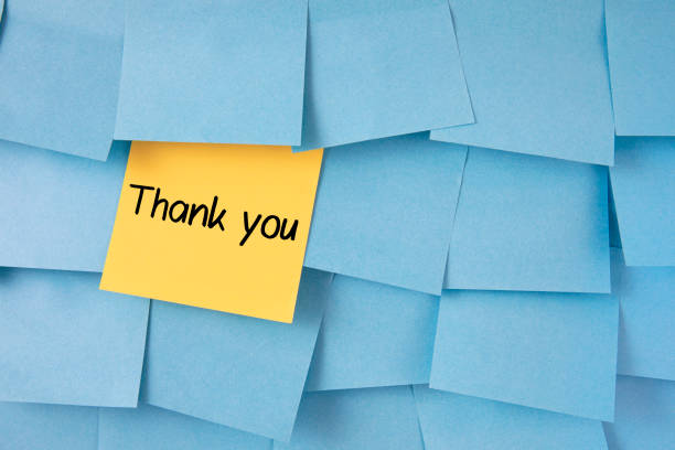 istock Thank You Message on Adhesive Notes on Bulletin Board 1226455082