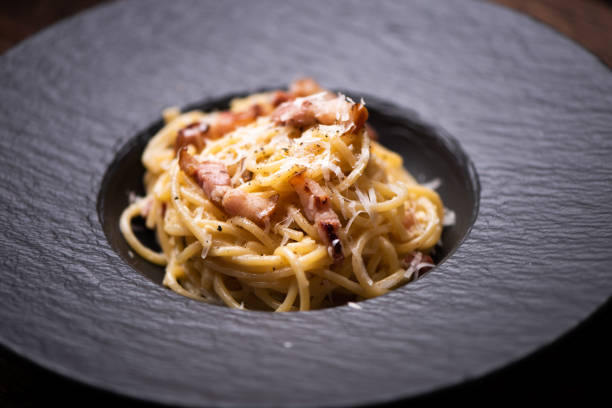 istock Spagetti carbonara on a black plate 1226456068