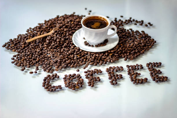 istock White cup of coffee and coffee beans. 1226457985