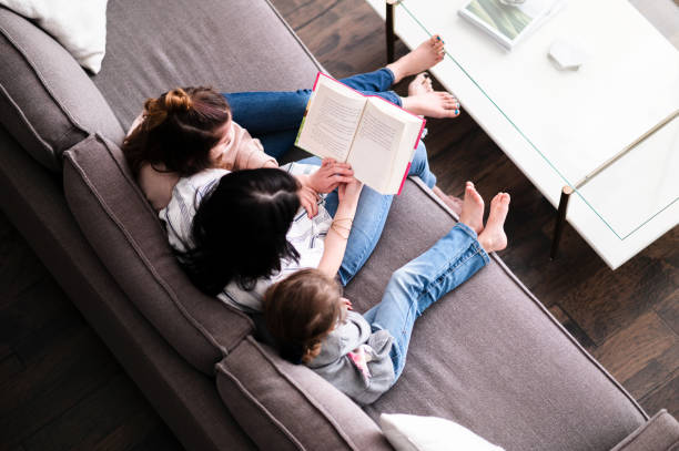 istock Family reads book together 1226458539