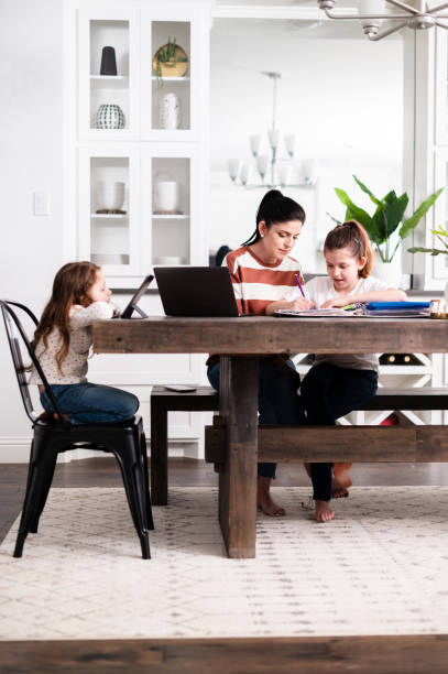 istock Mom helps daughter with homework 1226458552