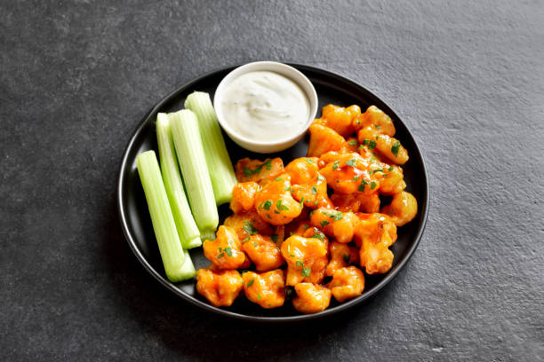 istock Cauliflower buffalo wings with celery and sauce 1226459457