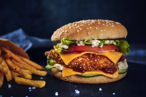 istock Crispy Chicken Burger with Cheese, Tomato, Onions and Lettuce 1226464250