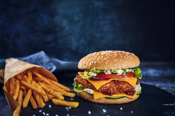 istock Crispy Chicken Burger with Cheese, Tomato, Onions and Lettuce 1226464258