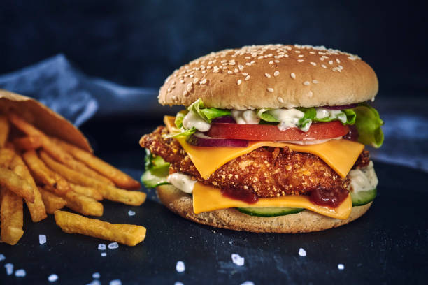 istock Crispy Chicken Burger with Cheese, Tomato, Onions and Lettuce 1226464278