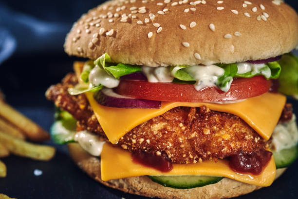istock Crispy Chicken Burger with Cheese, Tomato, Onions and Lettuce 1226464351