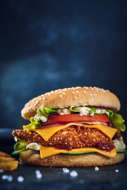 istock Crispy Chicken Burger with Cheese, Tomato, Onions and Lettuce 1226464364