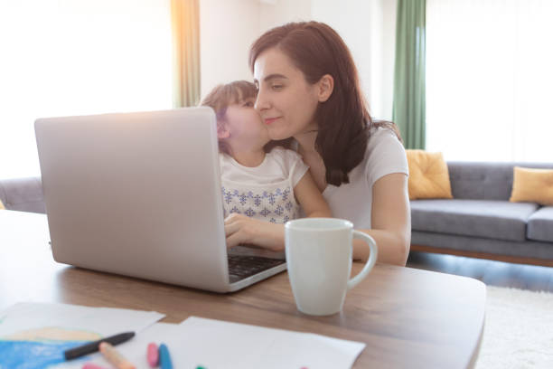 istock Young mother working and spending time with her daughter 1226464402