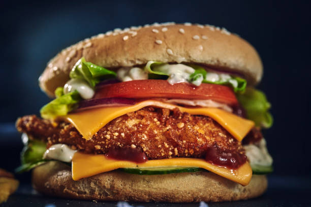 istock Crispy Chicken Burger with Cheese, Tomato, Onions and Lettuce 1226464410