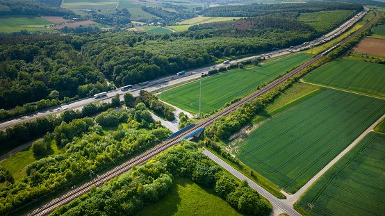 German highway and highspeed train railroad track - aerial view