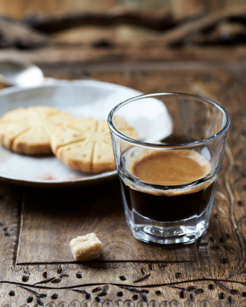 istock Coffee in glass cup on rustic wooden background. Close up. 1226468819