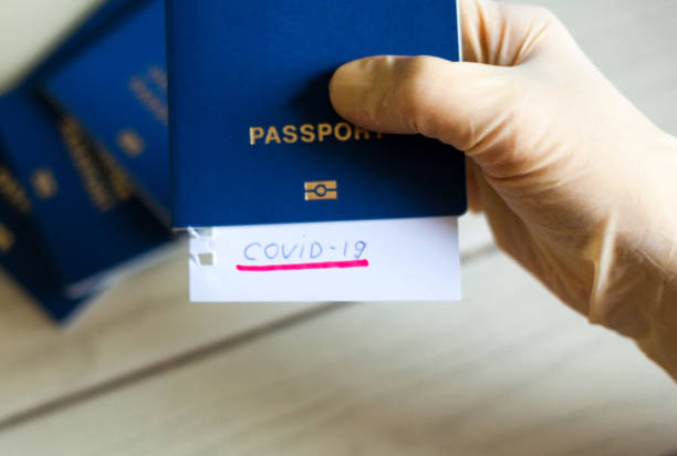 istock Passport and note with Covid-19 inscription. 1226469283