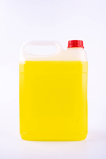Plastic canister with pen and red cap, yellow liquid, mock up object, isolated on white background.