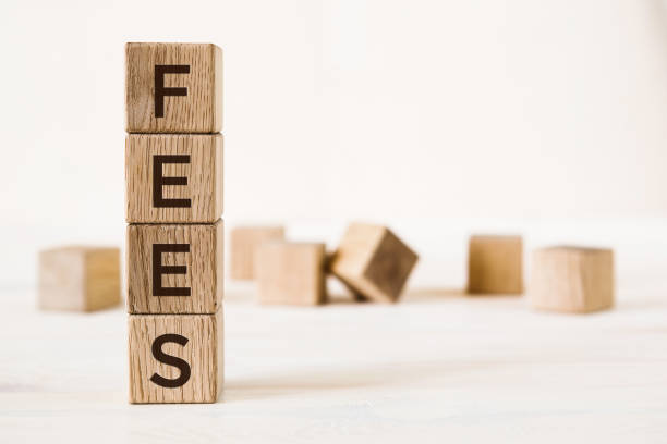 istock Fees word written on wooden cubes on light background with copy space 1226470296