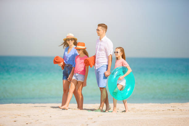 istock Happy family on the beach during summer vacation 1226471516