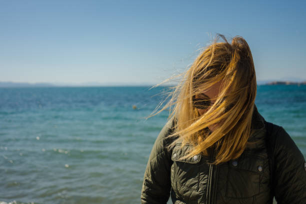istock Young woman by the sea 1226471567