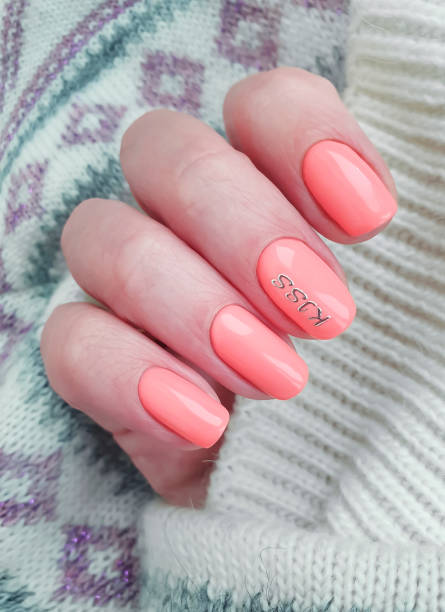 istock female hand beautiful manicure sweater 1226472449