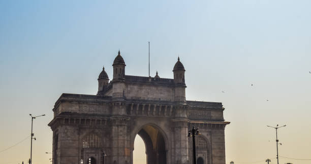 Beautiful Gateway of India near Taj Palace hotel on the Mumbai harbour with many jetties on Arabian sea Beautiful Gateway of India near Taj Palace hotel on the Mumbai harbour with many jetties on Arabian sea near Chhatrapati Shivaji monument archaelogy stock pictures, royalty-free photos & images