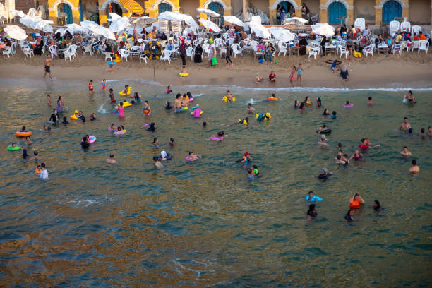 People swim in Stanley Beach, Alexandria, Egypt, September 3, 2019