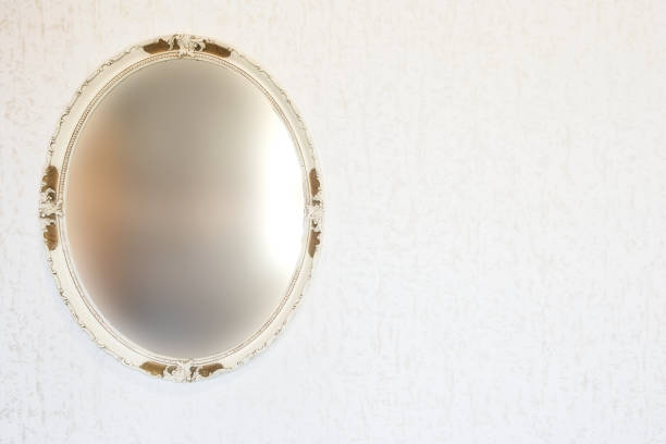 istock Antique vintage blurred mirror on wall with wallpaper, retro vintage design space for text 1226477683
