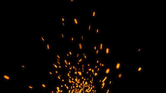 Burst of fire with traces from glowing particles.