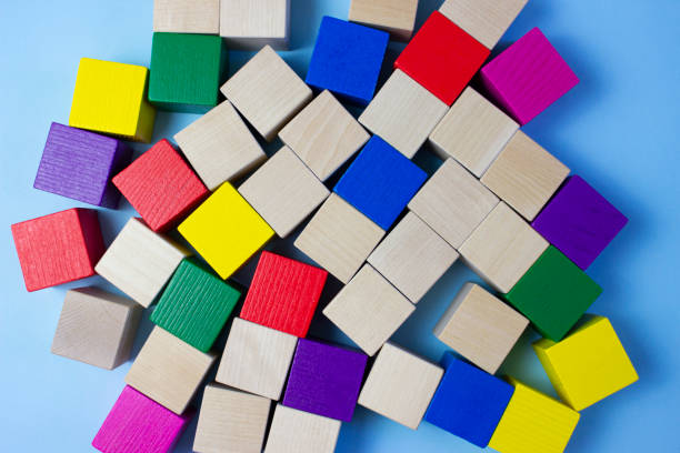 istock Colorful, multi-colored wooden cubes on a blue background. Eco-friendly materials in the manufacture of toys. Children's toys made of wood. 1226478891