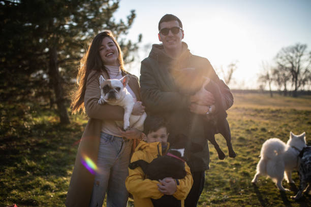 istock A happy family with small dogs 1226479036
