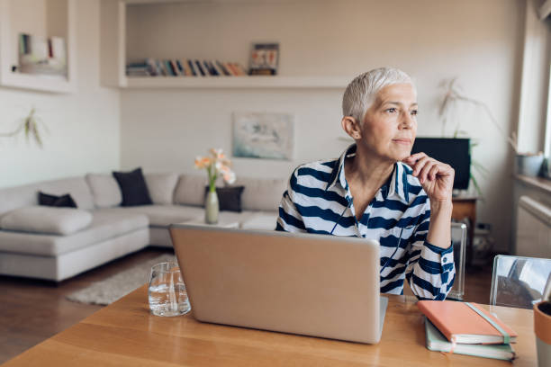 istock Unemployed woman sitting thoughtfully while searching a job 1226480917