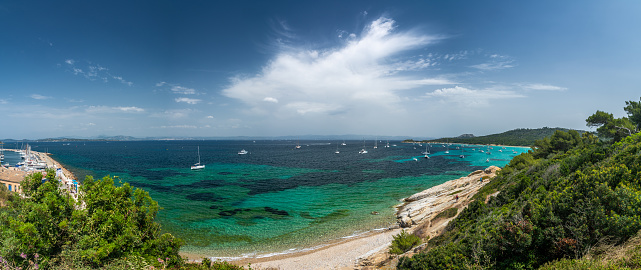 Porquerolles, France - June 10, 2019 : People on the beach of Courtade in Porquerolles, one of the most beautiful island of France