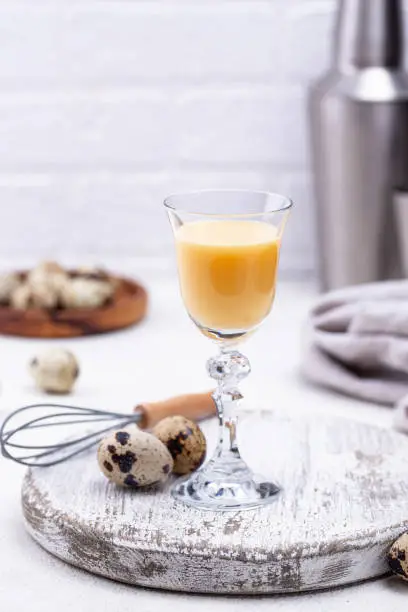 Glass of egg liquor and quail eggs