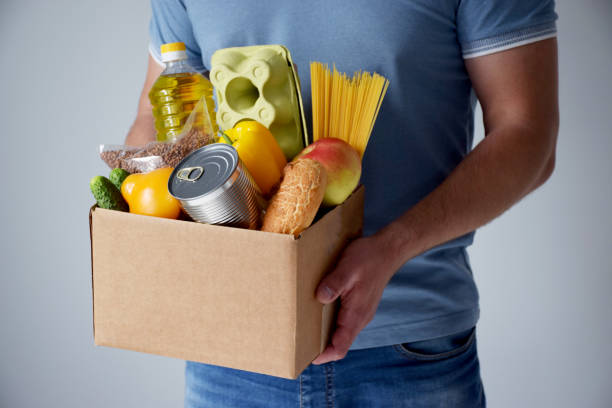 istock Donation cardboard box with various food 1226483556