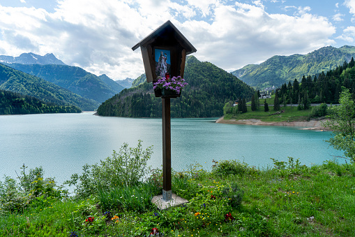 a votive icon on the shore of Lake Sauris, Italy