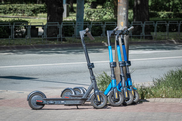 istock Blue dockless electric scooters on the sidewalk. Alternative transport. 1226485222