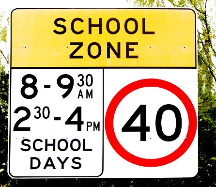 school sign for speed limit