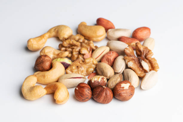 istock Mix of nuts on a white background 1226494748