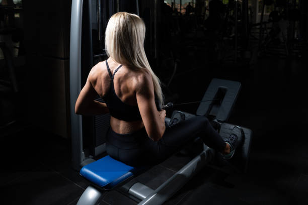 istock Attractive Woman Doing Heavy Weight Exercise For Back 1226496727