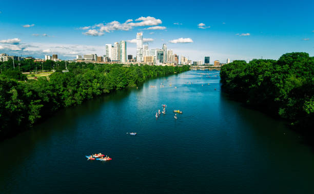 Blue summer days above Lady Bird Lake in Austin Texas Aerial drone views with people enjoying the summer heat on the waters of Town Lake or Colorado River high above Austin Texas USA austin texas photos stock pictures, royalty-free photos & images