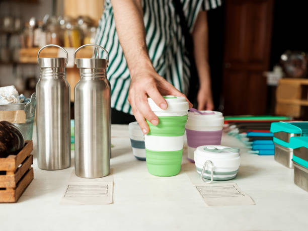 Latin man holding reusable bottle in shop
