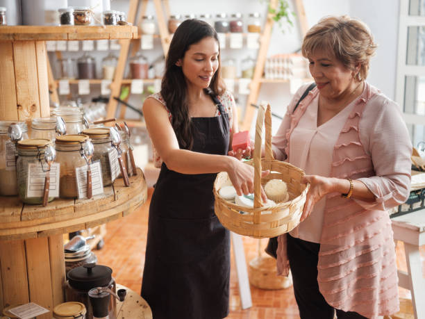 istock Hispanic female employee helping female customer 1226500616