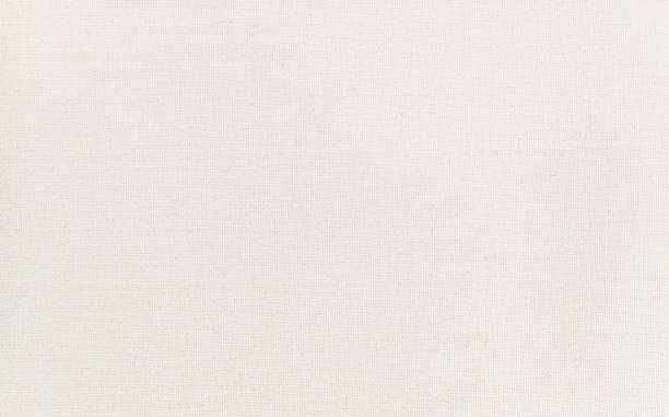 istock High quality artist canvas texture, macro shot with clear details. Clean surface. Natural ivory - cream colored, blank painting canvas. 1226505076