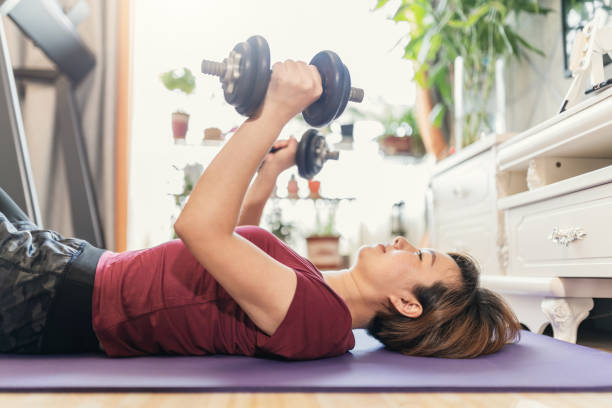 istock Woman do exercising at home 1226512019