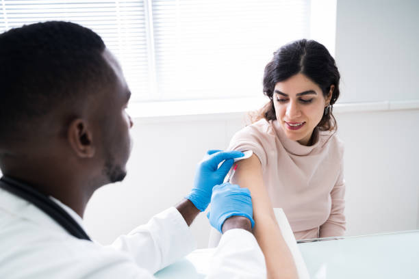 istock Doctor Injecting Patient With Coronavirus Vaccine 1226514696