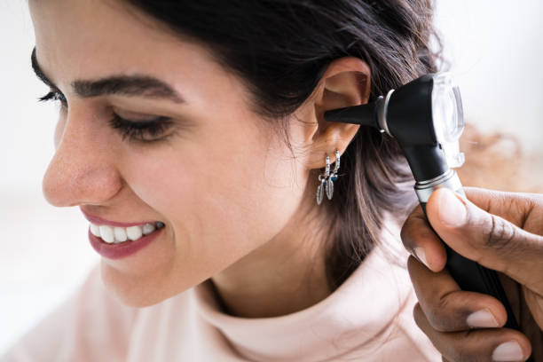 istock Doctor Examining Patient's Ear 1226514723
