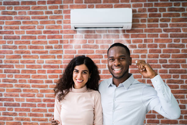 istock Couple With Remote Control Air Conditioner 1226515160